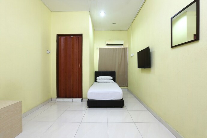 Imagen de la habitación del Hotel Spot On 89925 Thank Q Inn 1. Foto 31