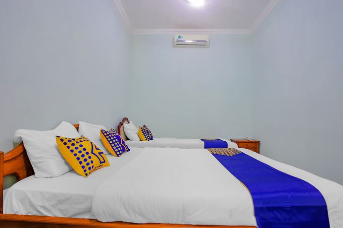 Imagen de la habitación del Hotel Spot On 90100 Kediri Bandungan. Foto 6