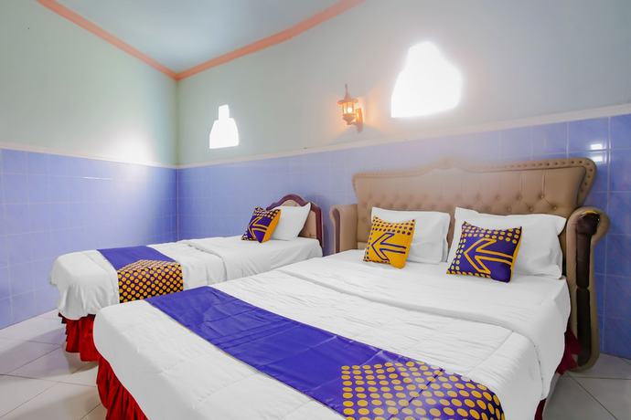 Imagen de la habitación del Hotel Spot On 90100 Kediri Bandungan. Foto 7