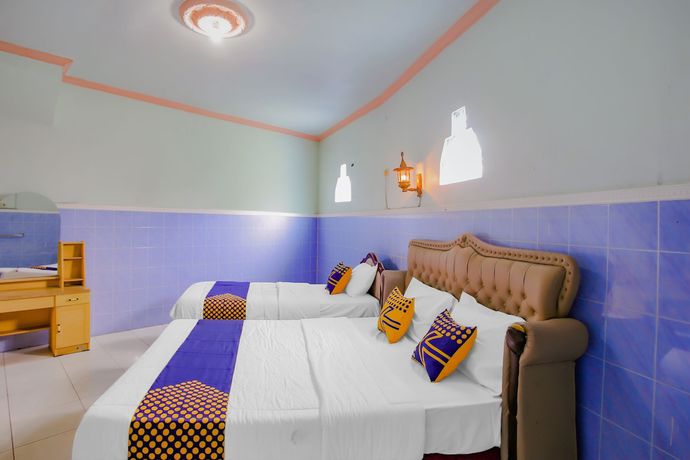 Imagen de la habitación del Hotel Spot On 90100 Kediri Bandungan. Foto 13