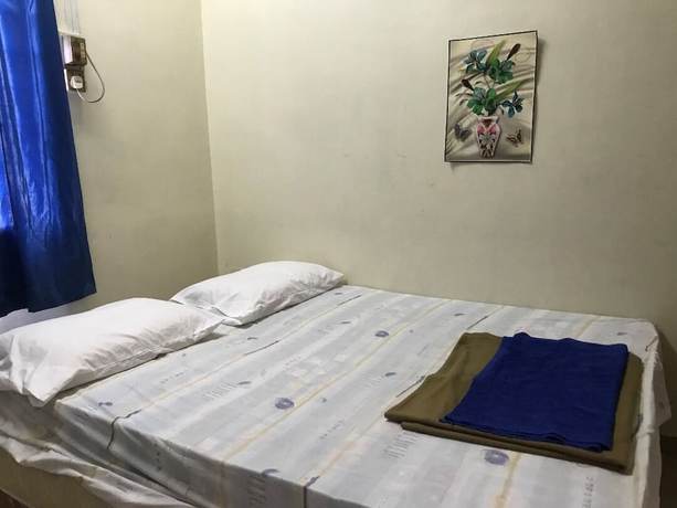 Imagen de la habitación del Hotel Spot On 90625 Super Green Grass. Foto 3