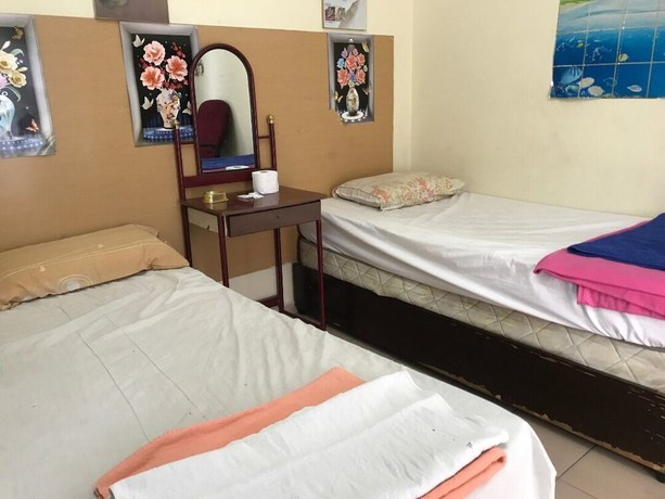 Imagen de la habitación del Hotel Spot On 90625 Super Green Grass. Foto 5