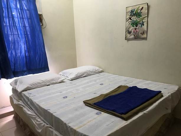 Imagen de la habitación del Hotel Spot On 90625 Super Green Grass. Foto 7