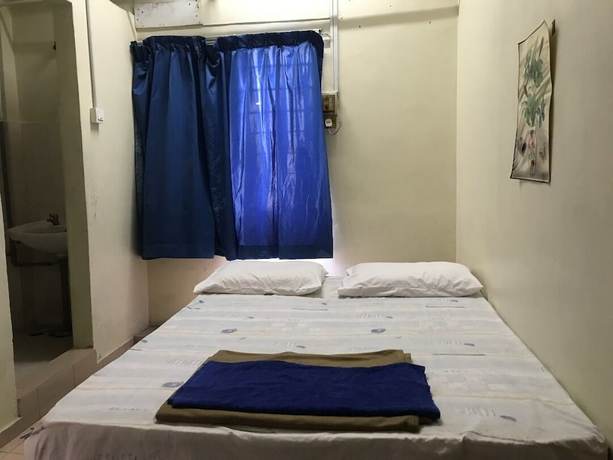 Imagen de la habitación del Hotel Spot On 90625 Super Green Grass. Foto 8