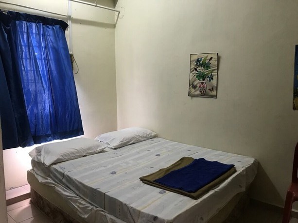 Imagen de la habitación del Hotel Spot On 90625 Super Green Grass. Foto 10