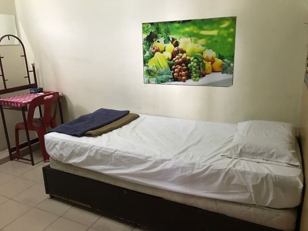 Imagen de la habitación del Hotel Spot On 90625 Super Green Grass. Foto 12