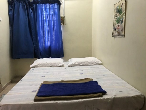 Imagen de la habitación del Hotel Spot On 90625 Super Green Grass. Foto 14