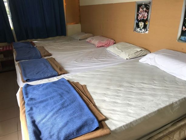 Imagen de la habitación del Hotel Spot On 90625 Super Green Grass. Foto 15