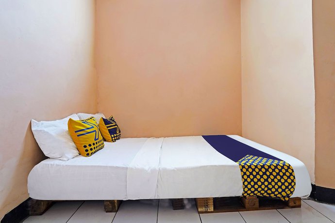 Imagen de la habitación del Hotel Spot On 91367 Rumah Bundo Syariah. Foto 10