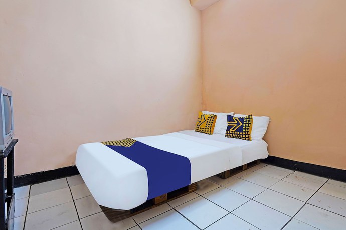 Imagen de la habitación del Hotel Spot On 91367 Rumah Bundo Syariah. Foto 11