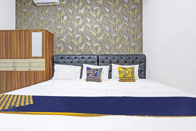 Imagen de la habitación del Hotel Spot On 91521 Mayong Guesthouse. Foto 15