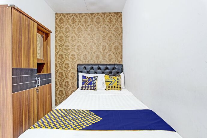 Imagen de la habitación del Hotel Spot On 91521 Mayong Guesthouse. Foto 16