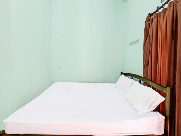 Imagen de la habitación del Hotel Spot On 91771 Homestay Bang Haji. Foto 17