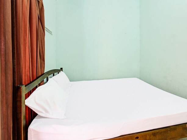 Imagen de la habitación del Hotel Spot On 91771 Homestay Bang Haji. Foto 18