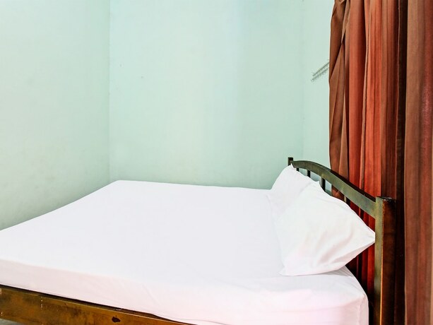 Imagen de la habitación del Hotel Spot On 91771 Homestay Bang Haji. Foto 19