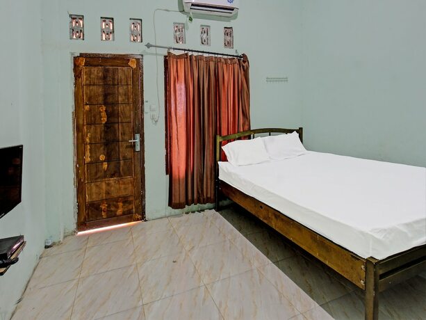 Imagen de la habitación del Hotel Spot On 91771 Homestay Bang Haji. Foto 20