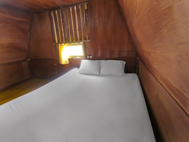 Imagen de la habitación del Hotel Spot On 92462 Awenk Homestay. Foto 20