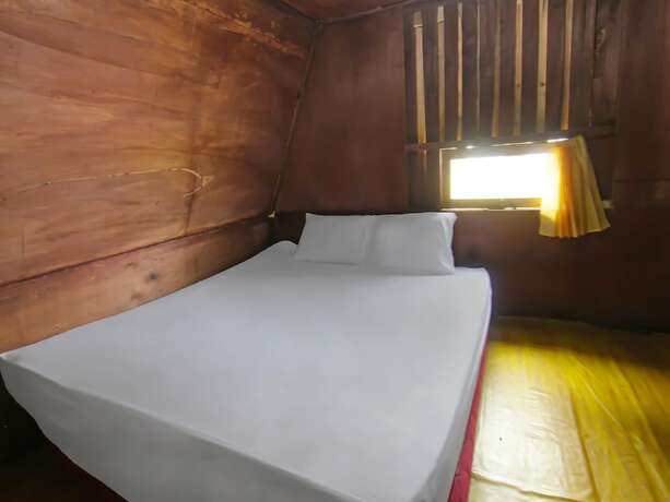 Imagen de la habitación del Hotel Spot On 92462 Awenk Homestay. Foto 23