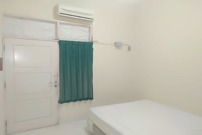 Imagen de la habitación del Hotel Spot On 93464 Penginapan Tulimario. Foto 21