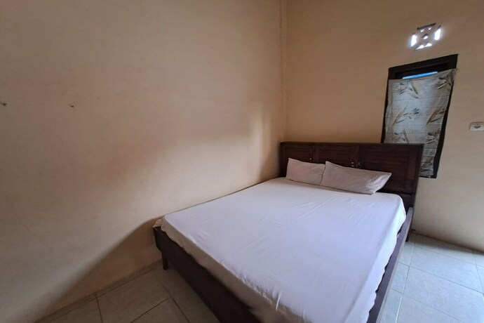 Imagen de la habitación del Hotel Spot On 93465 Archa Guest House Syariah. Foto 23