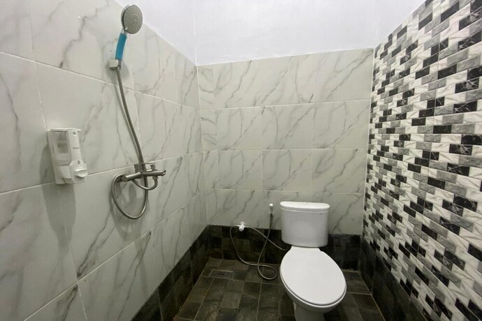 Imagen de la habitación del Hotel Spot On 93510 Penginapan Melati Tanjung. Foto 24