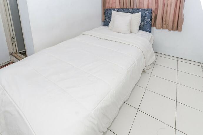 Imagen de la habitación del Hotel Spot On 93515 Pulo Gebang Guest House. Foto 20