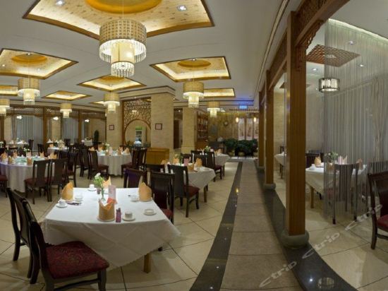 Imagen del bar/restaurante del Hotel Spring City Garden Hotel. Foto 10