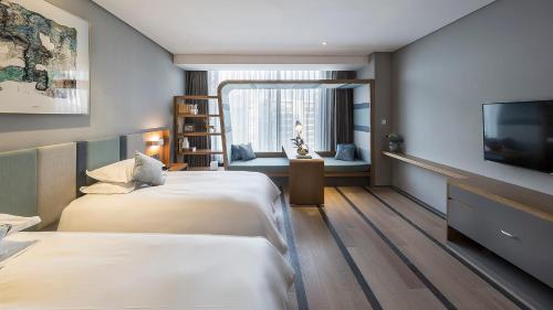 Imagen de la habitación del Hotel Ssaw Pagoda Shanghai. Foto 5