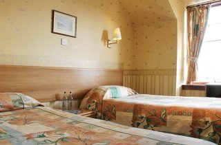 Imagen de la habitación del Hotel St Michaels Inn Hotel. Foto 5