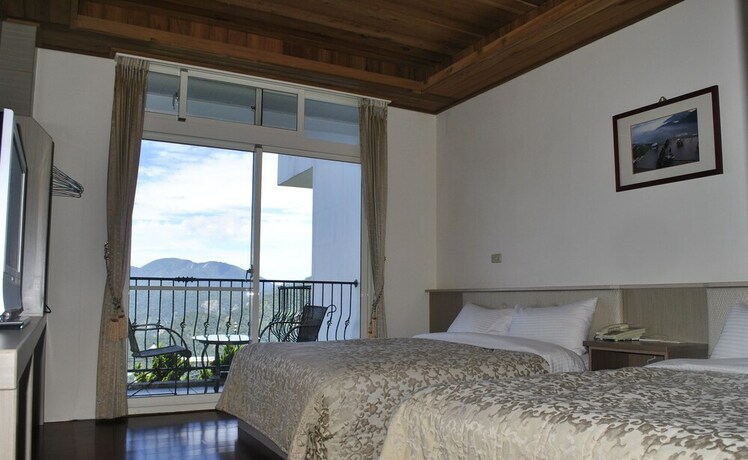 Imagen de la habitación del Hotel Star Villa, Ren'ai. Foto 11