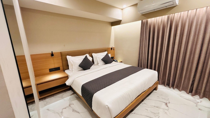 Imagen de la habitación del Hotel Star wood, Rajkot. Foto 6