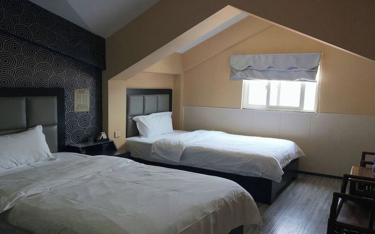 Imagen de la habitación del Hotel StarChain Zengcuoan Xiamen. Foto 15