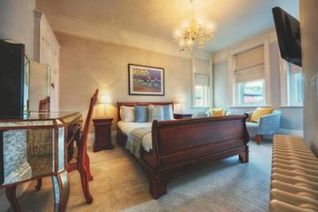 Imagen de la habitación del Hotel Stattons Boutique. Foto 8