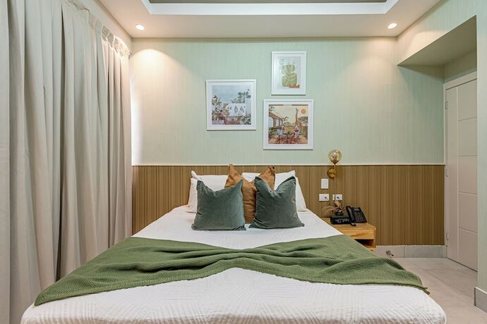 Imagen de la habitación del Hotel Stay Here Suites. Foto 14