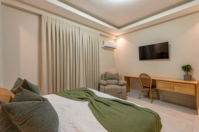 Imagen de la habitación del Hotel Stay Here Suites. Foto 17