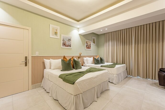 Imagen de la habitación del Hotel Stay Here Suites. Foto 18