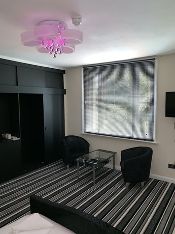 Imagen de la habitación del Hotel Stifford clays farm hotel. Foto 15