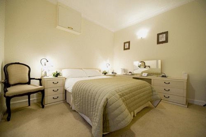 Imagen de la habitación del Hotel Stoke Rochford Hall. Foto 13