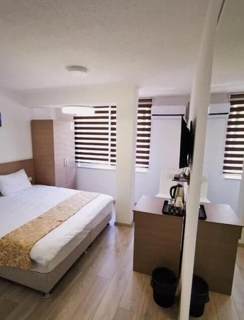 Imagen de la habitación del Hotel Stone Bridge Guesthouse. Foto 13