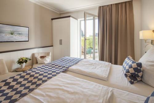 Imagen de la habitación del Hotel Strandgr&uuml;n Golf- and Spa Resort. Foto 6