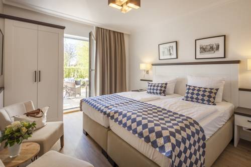 Imagen de la habitación del Hotel Strandgr&uuml;n Golf- and Spa Resort. Foto 7