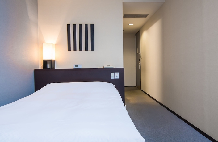 Imagen de la habitación del Hotel Strix Tokyo. Foto 11