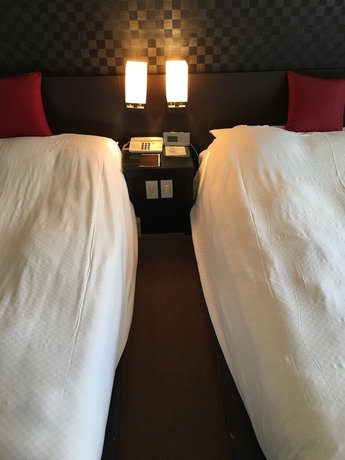Imagen de la habitación del Hotel Strix Tokyo. Foto 16