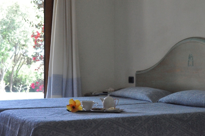 Imagen de la habitación del Hotel Su Giganti. Foto 2