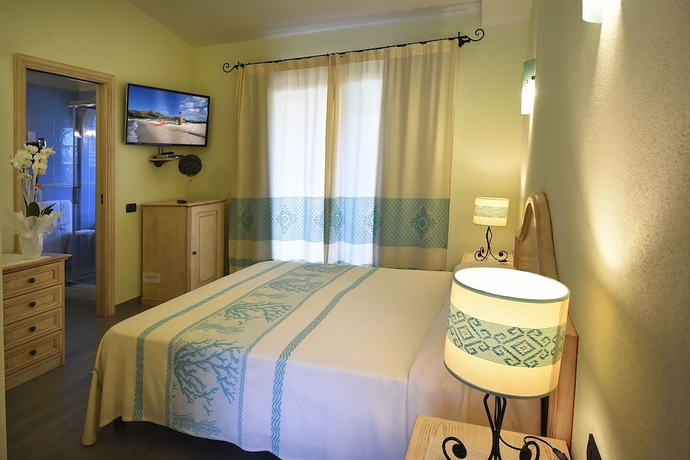 Imagen de la habitación del Hotel Su Giganti. Foto 3