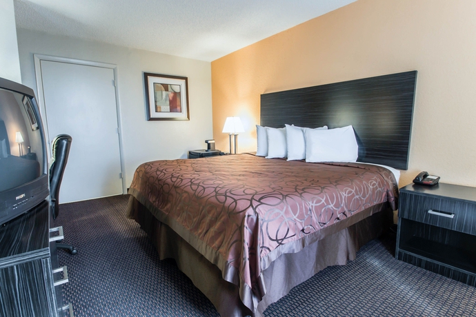 Imagen de la habitación del Hotel Suburban Studios International Drive. Foto 11