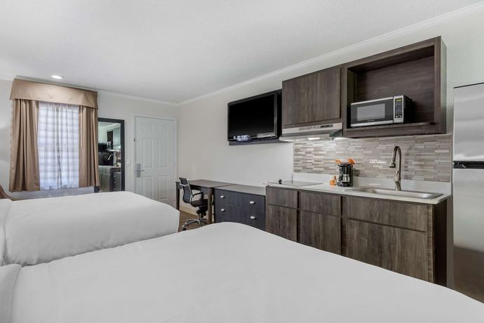 Imagen de la habitación del Hotel Suburban Studios at the University. Foto 8