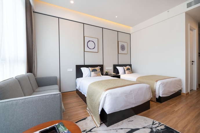 Imagen de la habitación del Hotel Suisse Place Shanghai. Foto 10