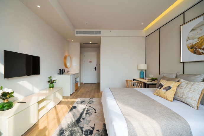 Imagen de la habitación del Hotel Suisse Place Shanghai. Foto 18