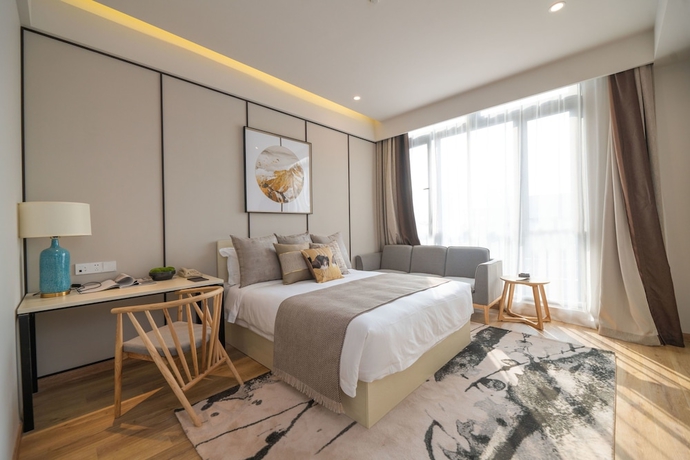 Imagen de la habitación del Hotel Suisse Place Shanghai. Foto 19